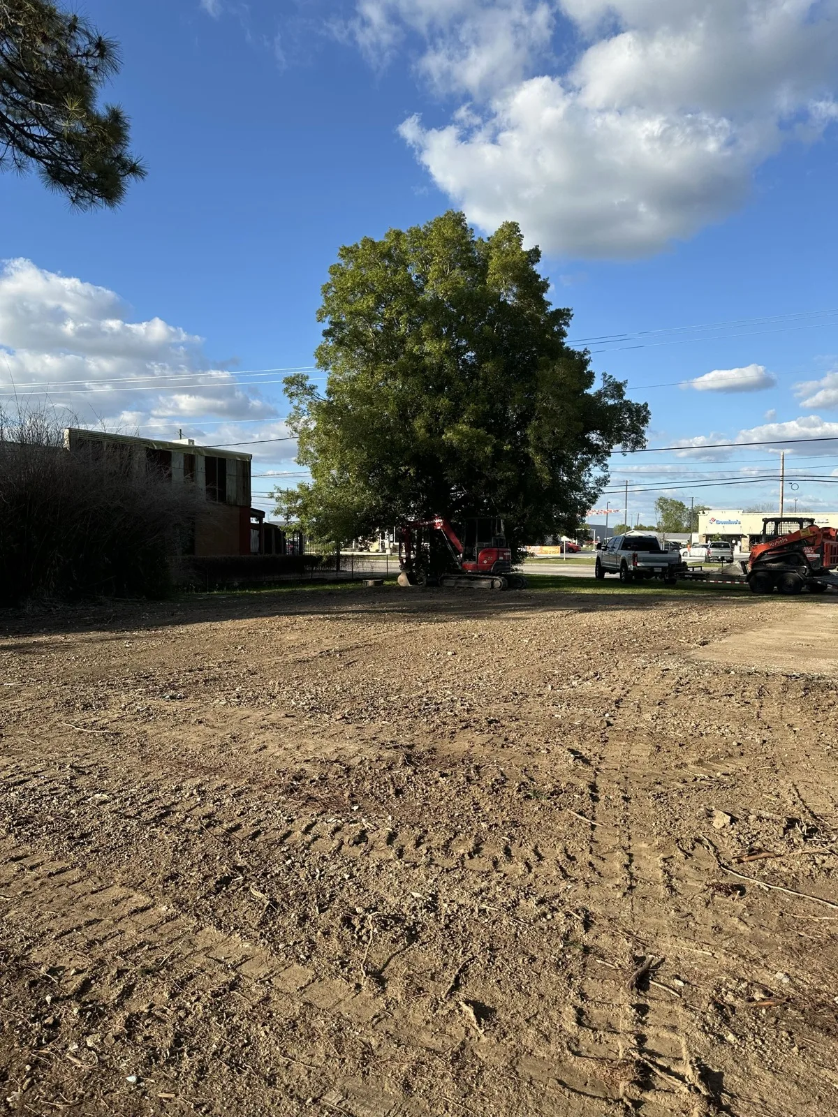 Lot graded smooth after clearing and dirt work in Acadiana.